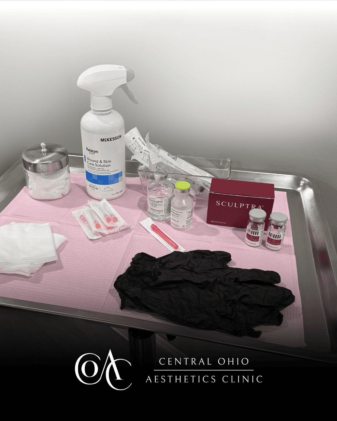 A tray displaying various gloves and additional items arranged neatly on its surface.